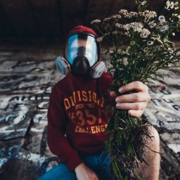 man holding white flowers